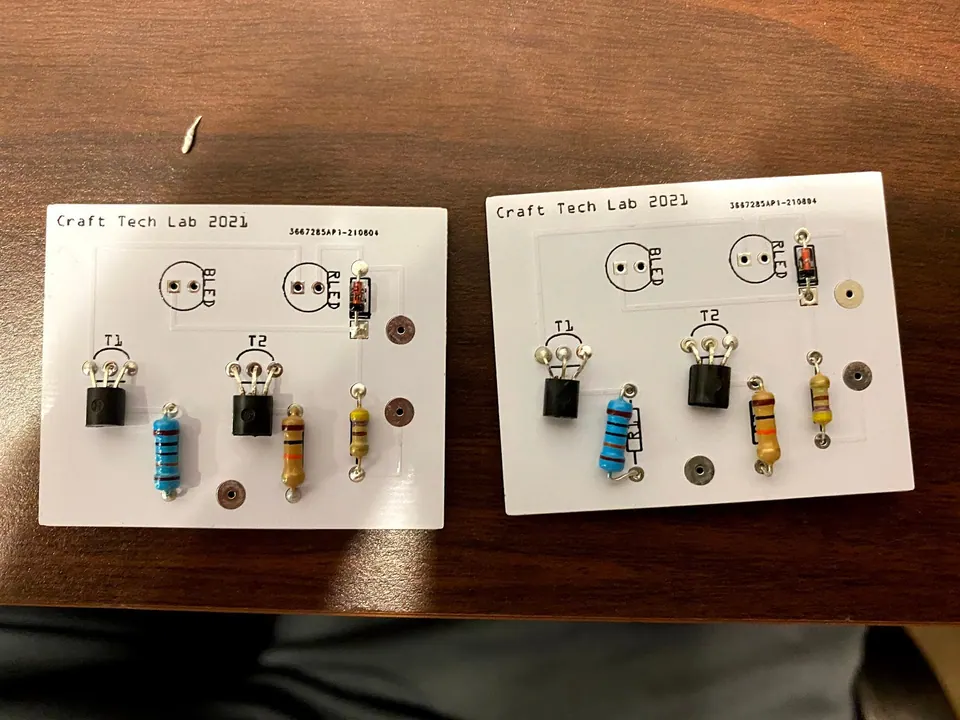 Two assembled probe circuit boards side by side on a table, printed Craft Tech Lab 2021
