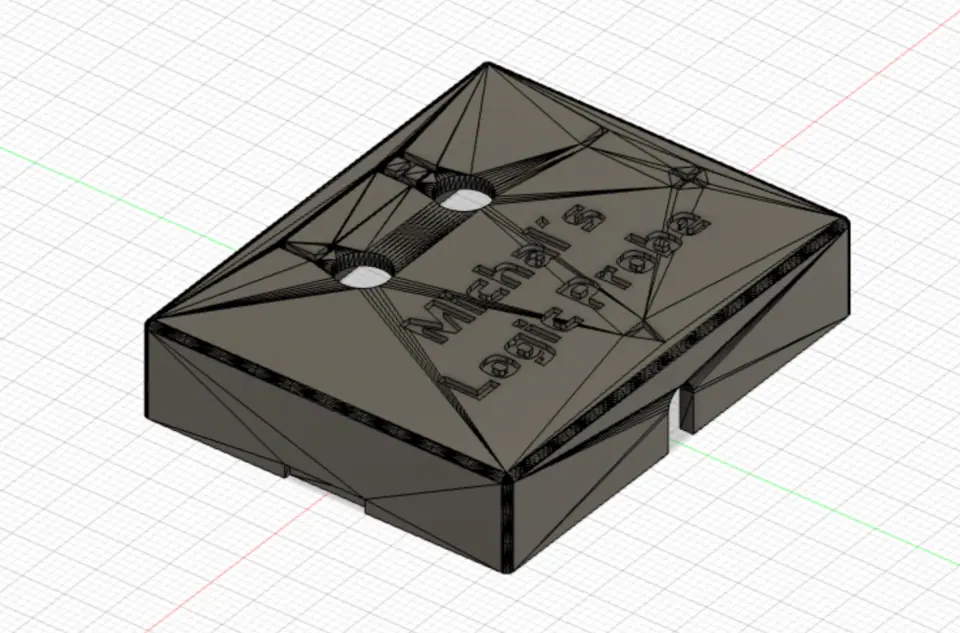 Fusion 360 view of the housing top with the engraved name on a triangulated mesh surface