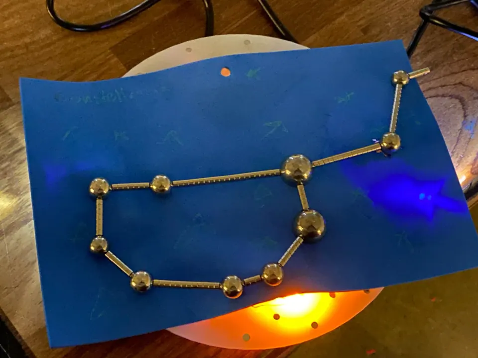 The same constellation with blue light around the star pad and a yellow glow at the bottom
