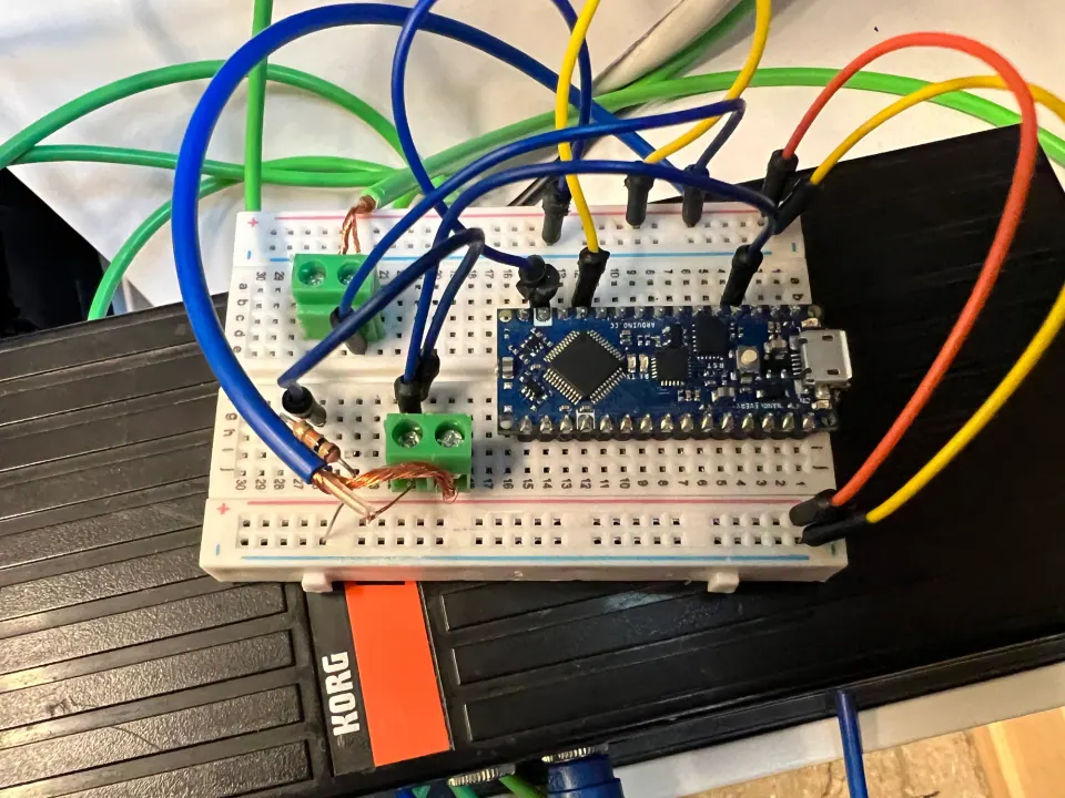 Arduino Nano on a breadboard with colorful jumper wires